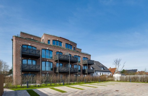 List Apartment | Turtle Bay Suite - Luxury on 65m² in List, Sylt with a Fireplace and Balcony.