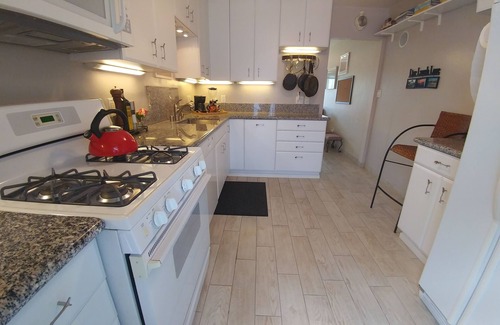 Crown Point Cottage | Two bedroom beach cottage in PB with AC. Parking, patio, garage. Walk to beach.