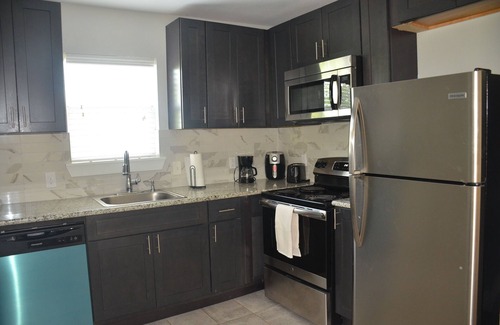 Northside House | Two bedroom, one bath, modern bungalow with full kitchen and outdoor dining.