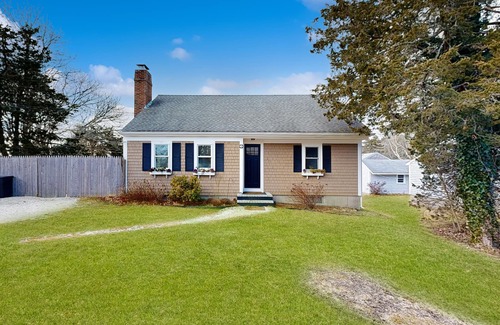 Harwich House | Two-story dog-friendly retreat with enclosed yard, playset, W/D, & firepit