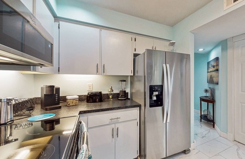 Inverness House | Two-story townhome with lake access, pool, bbq grill, screened patio