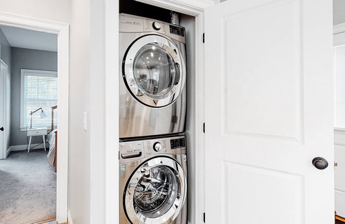 Arundel Condo | Two stroy condo with heated pool, gym, private patio, gas fireplace, W/D, AC