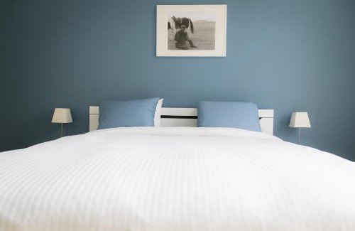 Ieper House | Two White Pigeons