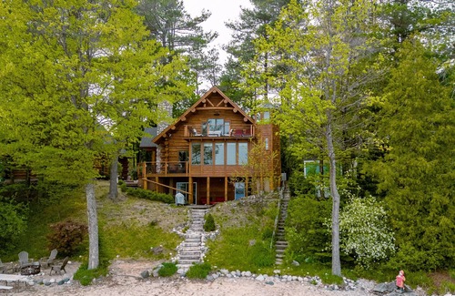 Suttons Bay Cabin | Unforgettable Log Cabin Experience: Family-owned, Lakefront, Private Beach