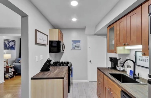 Rosemont House | Unique duplex that has 2 family rooms and 2 kitchens