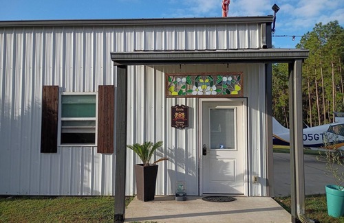 Langley House | Unique Hangar & RV Experience with paddock and shelter for Horses