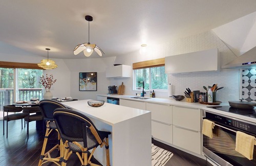 Burley House | Unique waterfront home with sauna, hot tub, and washer & dryer