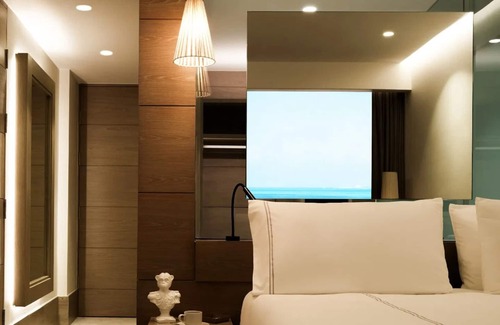 Punta Sam Hotel | Unwind in Style: Beachfront Resort w/Tranquil Pools, Spa & Delicious Cuisine