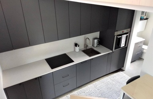 Bozeman House | Unwind in the sizeable comforts of this small modern space.