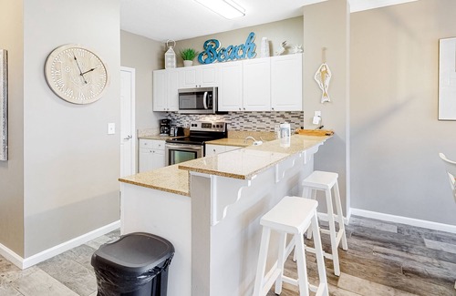 Frangista Beach Condo | Updated, beachside condo with dual suites, balcony & pool - walkable locale