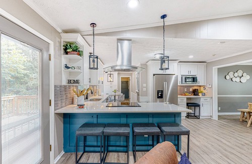 Lilburn House | Updated home with movie room, bar, entertainment space, Ping-Pong, & 2 kitchens