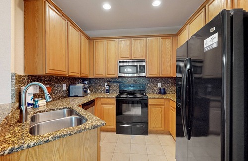 Trafalgar Village House | Updated retreat with pool access, W/D, AC, & patio - close to Disney Parks