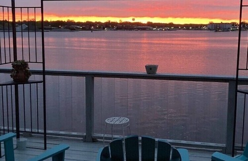 Ludington House | Upper level rental with large family room and huge wrap around deck full kitchen