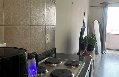 Downtown Johannesburg Apartment | Urban energy meets secure comfort in a historic landmark.