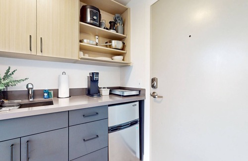 Old Ballard Apartment | Urban studio unit with patio views, shared lounge space and dedicated workspace