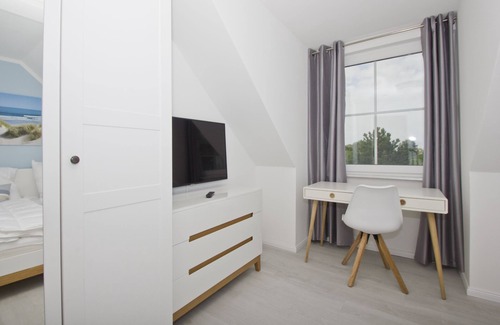 Gross Zicker Apartment | Vacation apartment with sea view and garden use - Haus Inselwind FeWo MEERduft