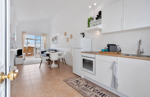 Caleta de Fuste Apartment | Vacation 'Calida Vivienda Accesible' with Shared Pool, Private Terrace and Wi-Fi