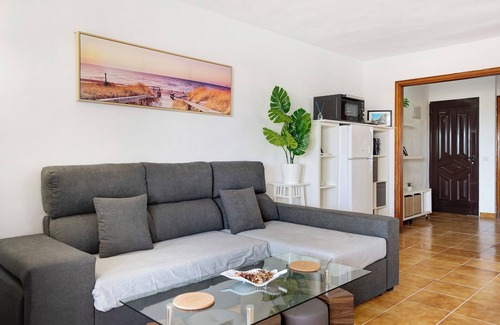 Costa Teguise Apartment | Vacation Apartment 'Casa Las Palmeras' with Shared Pool, Private Terrace and Wi-Fi