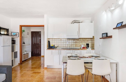 Costa Teguise Apartment | Vacation Apartment 'Casa Las Palmeras' with Shared Pool, Private Terrace and Wi-Fi