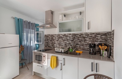 Playa de Arinaga Apartment | Vacation 'Casa Paula - 21' with Mountain View, Shared Pool and Wi-Fi