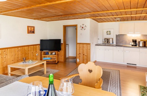 Grassau Apartment | Vacation home 45 sqm, for 2 pers., bedroom, living room, kitchen, south-facing terrace, large balcony. Sunbathing lawn, quiet location with mountain views.