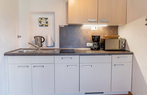 Grassau Apartment | Vacation home 45 sqm, for 2 pers., bedroom, living room, kitchen, south-facing terrace, large balcony. Sunbathing lawn, quiet location with mountain views.