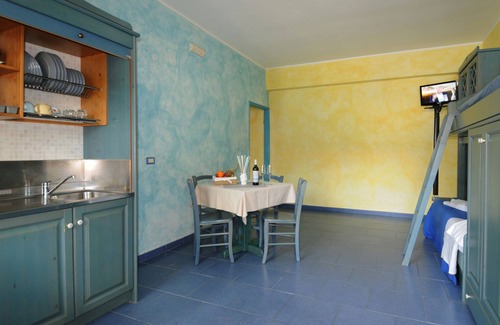 Province of Messina House | Vacation Home "Oasi Azzurra - Bilocale Standard-102" with Shared Pool & 2 Shared Terraces