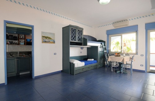 Province of Messina House | Vacation Home "Oasi Azzurra - Monolocale Standard 2" with Shared Pool & Shared Terrace