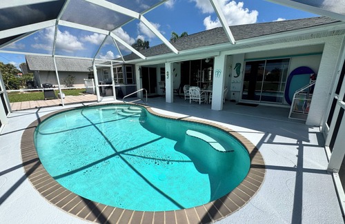 Broadmoor House | Vacation in Paradise on the Canal w/Heated Pool, minutes to Beach, Dog Friendly!