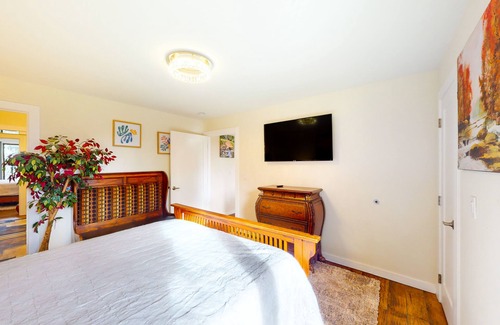 Nehalem House | Vibrant, dog-friendly stay with private hot tub, washer/dryer & fireplace