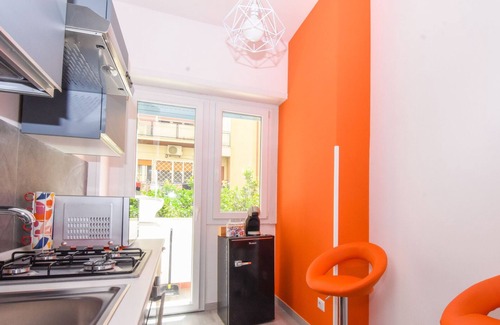 Ostiense Apartment | Vibrantly colored apartment on Salvatore Pincherle Street for 4 to four ospi