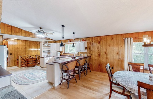 Franklin House | View-worthy home lined by trees with a fireplace, wrap-around deck, grill, & W/D