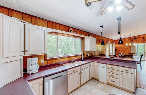 Franklin House | View-worthy home lined by trees with a fireplace, wrap-around deck, grill, & W/D