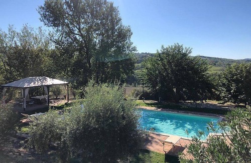 Todi Villa | Villa Gramigna: A charming two-story villa surrounded by the greenery.