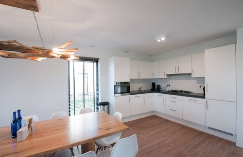 Tholen House | Villa in Netherlands with Waterfront Garden