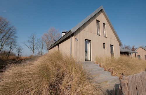 Tholen House | Villa in Netherlands with Waterfront Garden