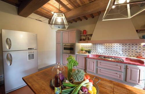 Torricella Villa | Villa Lago is set against a hillside of luscious greenery olive groves