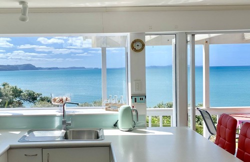 Red Beach House | Vintage Retro style Bach with stunning sea views