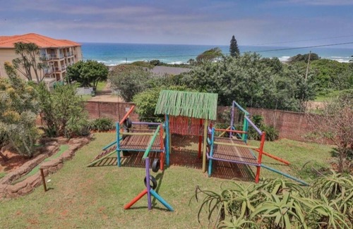 Illovo Beach Apartment | Wake up to the tranquil sight and sound of waves crashing against the shore.