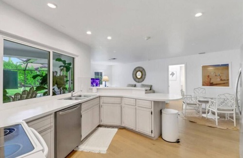 Moorings House | Walk to beach from home in The Moorings . Private heated pool & Pet-friendly.n