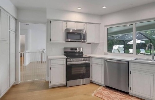 Moorings House | Walk to beach from home in The Moorings . Private heated pool & Pet-friendly.n