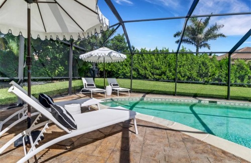 Moorings House | Walk to beach from home in The Moorings . Private heated pool & Pet-friendly.n
