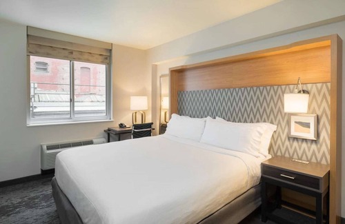 Financial District Hotel | Walk to One World Trade + Fitness Room & Wi-Fi