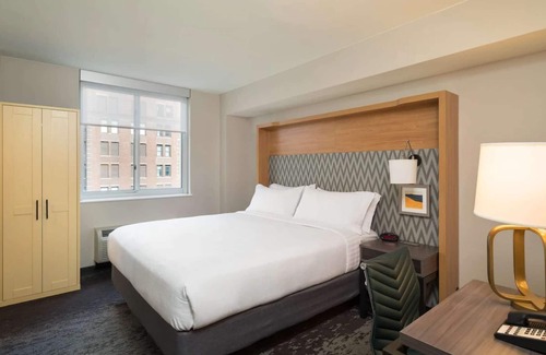 Financial District Hotel | Walk to One World Trade + Fitness Room & Wi-Fi