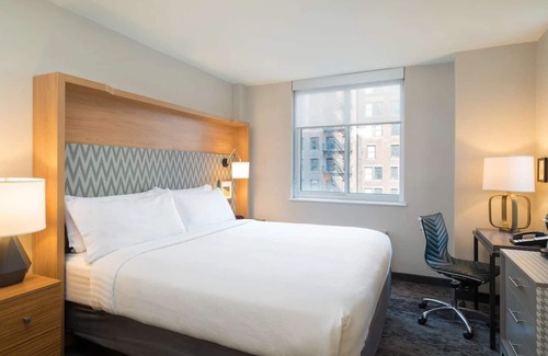 Financial District Hotel | Walk to One World Trade + Fitness Room & Wi-Fi