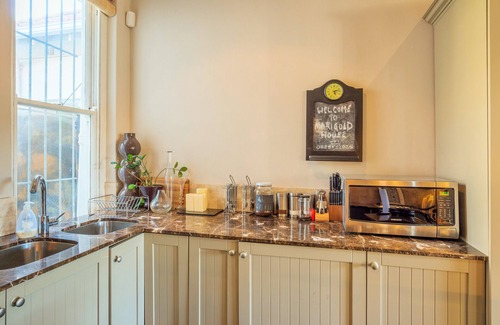 Green Point House | Walk to the Beach from a Cape Dutch Heritage Bungalow