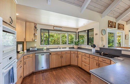 Princeville House | Walk to the beach in this lush, serene house with a private garden oasis