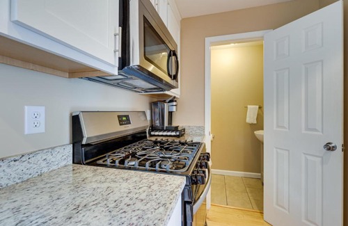 Central Business District Apartment | Walkable Downtown Apt with Game Room!