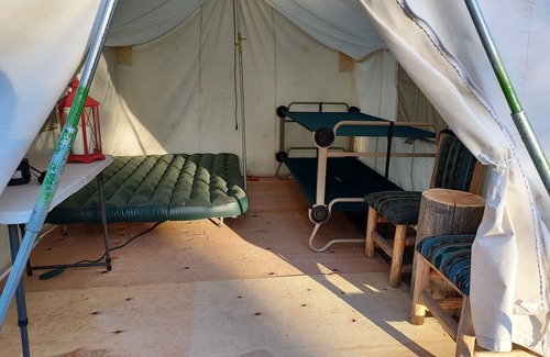 Libby RV Rental | Wall Tent by Happy's Inn with trails to Crystal Lake, bring your own bedding.
