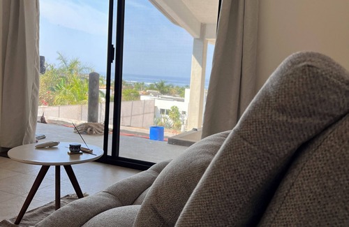 Troncones Bed & Breakfast | Warm room with the sea in the background and starry skies.